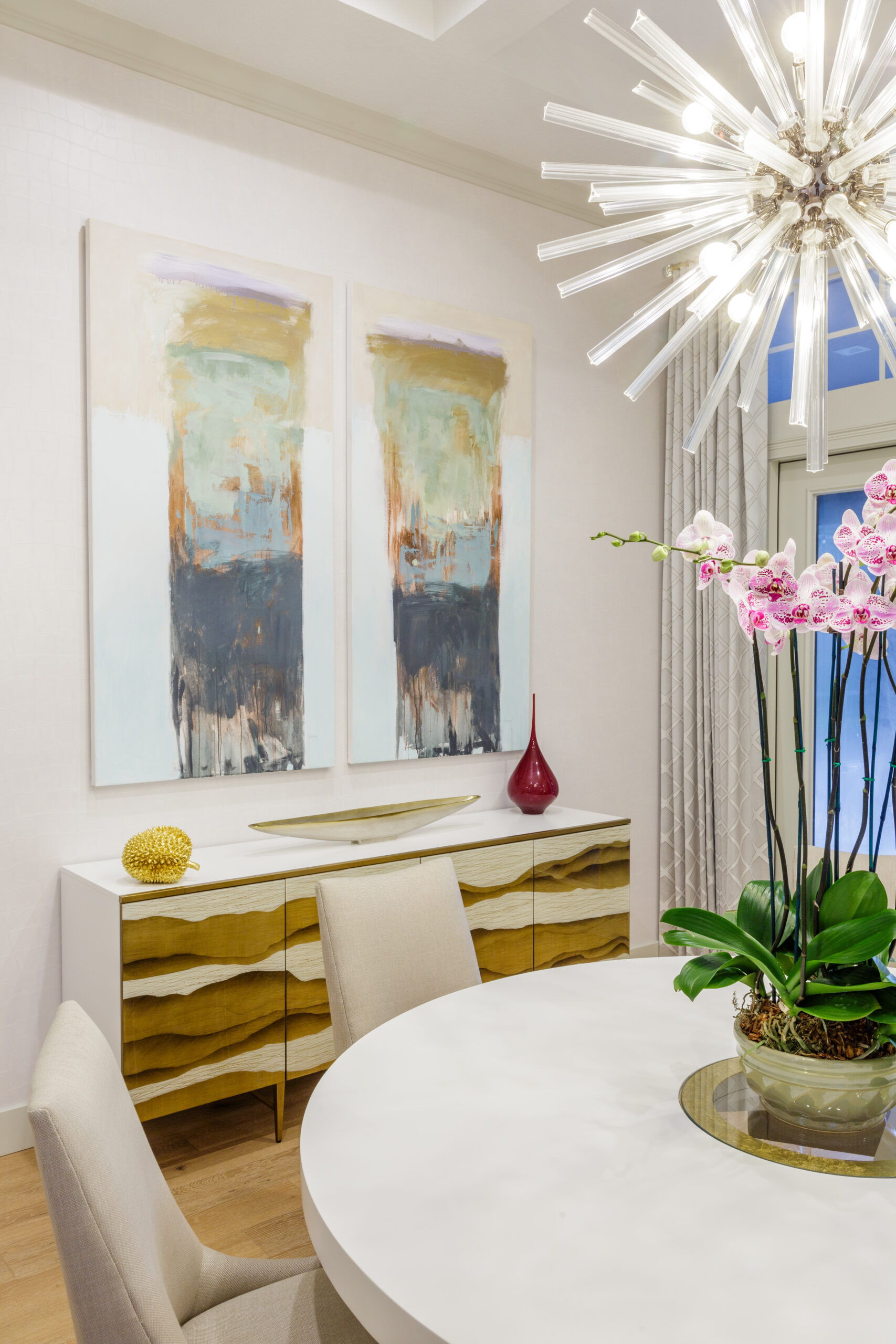 Dining Buffet Dining room buffet table and art. Full-service interior design Orlando. Photo by Steven Miller